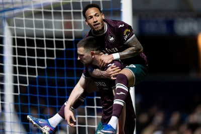 210426 - Queens Park Rangers v Swansea City - Sky Bet Championship - Zan Vipotnik of Swansea City celebrates with his teammate Ronald of Swansea City after scoring his sides second goal