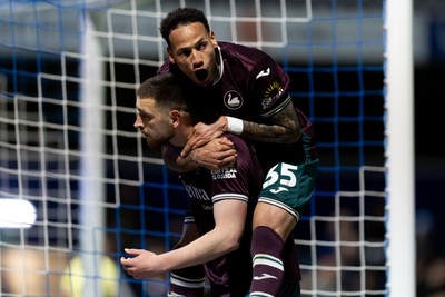 210426 - Queens Park Rangers v Swansea City - Sky Bet Championship - Zan Vipotnik of Swansea City celebrates with his teammate Ronald of Swansea City after scoring his sides second goal