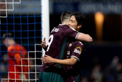 210426 - Queens Park Rangers v Swansea City - Sky Bet Championship - Zan Vipotnik of Swansea City celebrates with his teammate Eom Ji-Sung of Swansea City after scoring his sides second goal