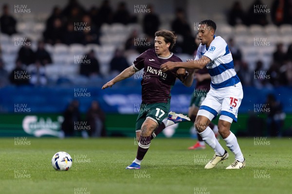 210426 - Queens Park Rangers v Swansea City - Sky Bet Championship - Goncalo Franco of Swansea City is challenged by Isaac Hayden of Queens Park Rangers