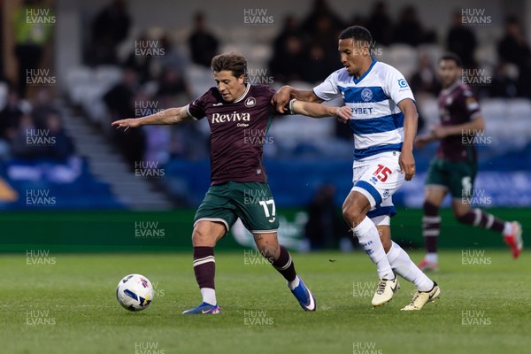 210426 - Queens Park Rangers v Swansea City - Sky Bet Championship - Goncalo Franco of Swansea City is challenged by Isaac Hayden of Queens Park Rangers