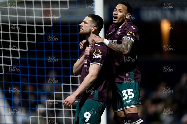 210426 - Queens Park Rangers v Swansea City - Sky Bet Championship - Zan Vipotnik of Swansea City celebrates with his teammate Ronald of Swansea City after scoring his sides second goal
