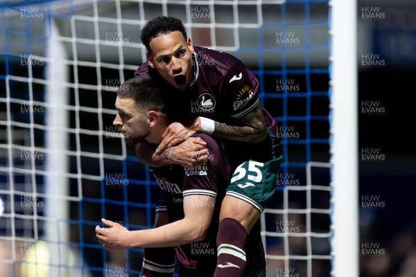 210426 - Queens Park Rangers v Swansea City - Sky Bet Championship - Zan Vipotnik of Swansea City celebrates with his teammate Ronald of Swansea City after scoring his sides second goal