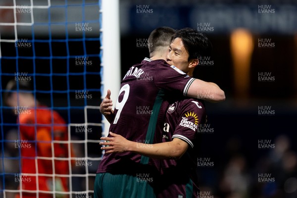 210426 - Queens Park Rangers v Swansea City - Sky Bet Championship - Zan Vipotnik of Swansea City celebrates with his teammate Eom Ji-Sung of Swansea City after scoring his sides second goal