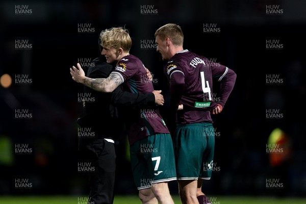 210426 - Queens Park Rangers v Swansea City - Sky Bet Championship - Vítor Matos manager of Swansea City hugs with Melker Widell of Swansea City after their sides victory