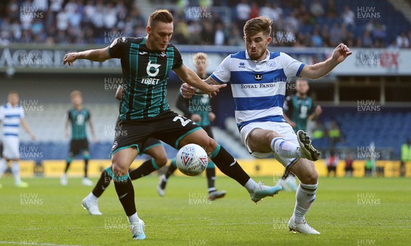 210819 - Queens Park Rangers v Swansea City  - SkyBet Championship - Connor Roberts of Swansea City is challenged by Ryan Manning of QPR