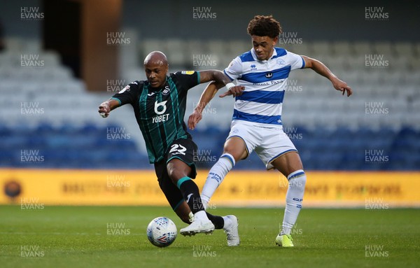 210819 - Queens Park Rangers v Swansea City  - SkyBet Championship - Andre Ayew of Swansea City is challenged by Luke Amos of QPR
