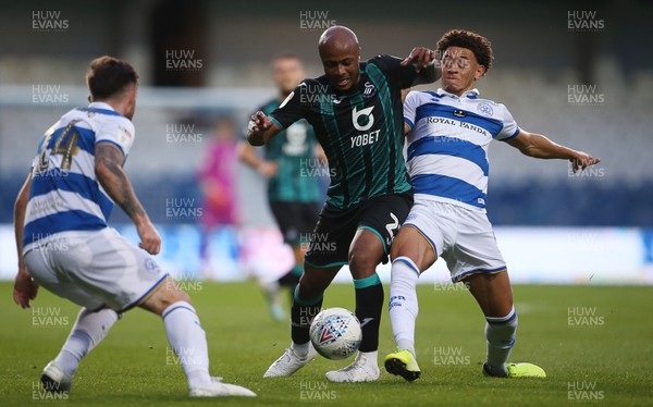 210819 - Queens Park Rangers v Swansea City  - SkyBet Championship - Andre Ayew of Swansea City is tackled by Luke Amos of QPR