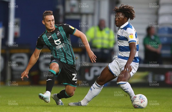210819 - Queens Park Rangers v Swansea City  - SkyBet Championship - Connor Roberts of Swansea City is challenged by Eberechi Eze of QPR