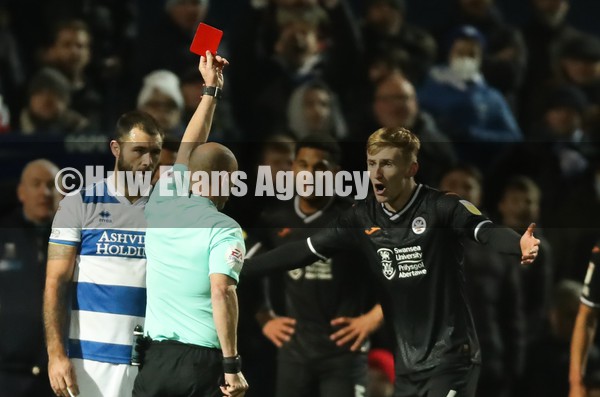 250122 - Queens Park Rangers v Swansea City, Sky Bet Championship - Flynn Downes of Swansea City is shown a red card