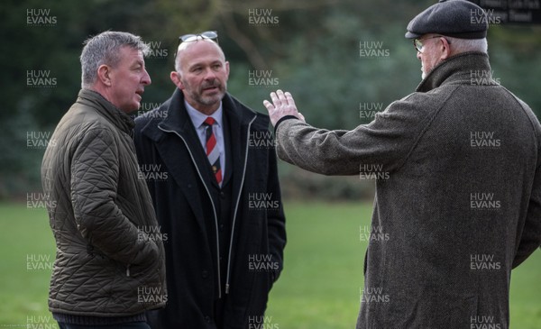 081220 - Former players Roger Bidgood, Alun Carter and  Eddie Butler catch up as they wait to pay his respects ahead of the funeral cortege of Pontypool RFC legend Ray Prosser which made  its way through Pontypool Park past Pontypool's clubhouse and ground