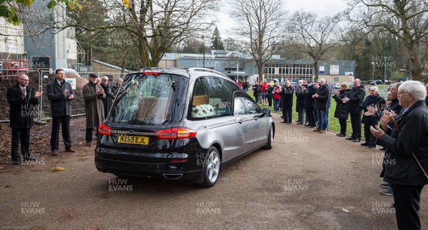 081220 -  Former players, club members and fans gather at Pontypool RFC and applaud as the funeral cortege of Pontypool RFC legend Ray Prosser makes its though Pontypool Park past Pontypool's clubhouse and ground