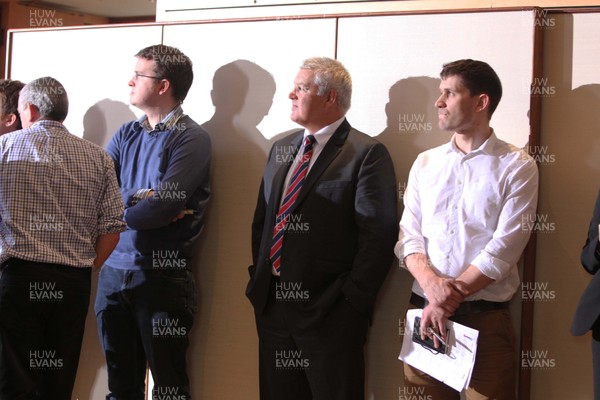 25.01.12 RBS Six Nations Rugby Launch, London... Wales coach Warren Gatland watches proceedings from the sidelines. 