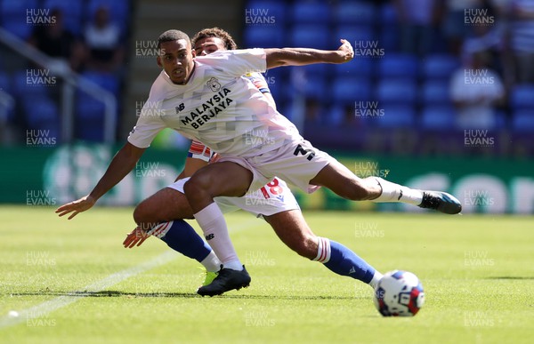 060822 - Reading v Cardiff City - SkyBet Championship - Andy Rinomhota of Cardiff City is tackled by Nesta Guinness-Walker of Reading