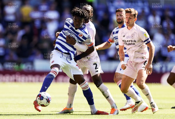060822 - Reading v Cardiff City - SkyBet Championship - Ovie Ejaria of Reading is tackled by Mahlon Romeo of Cardiff City