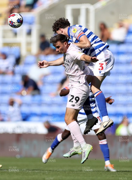060822 - Reading v Cardiff City - SkyBet Championship - Mark Harris of Cardiff City goes up for the ball with Tom Holmes of Reading