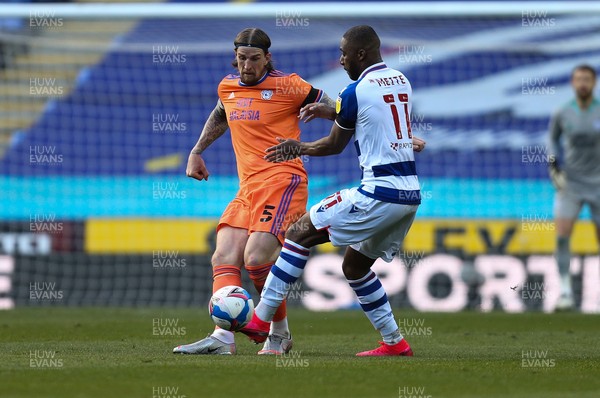 160421 Reading v Cardiff City, Sky Bet Championship - Aden Flint of Cardiff City plays the ball past Yakou Meite of Reading