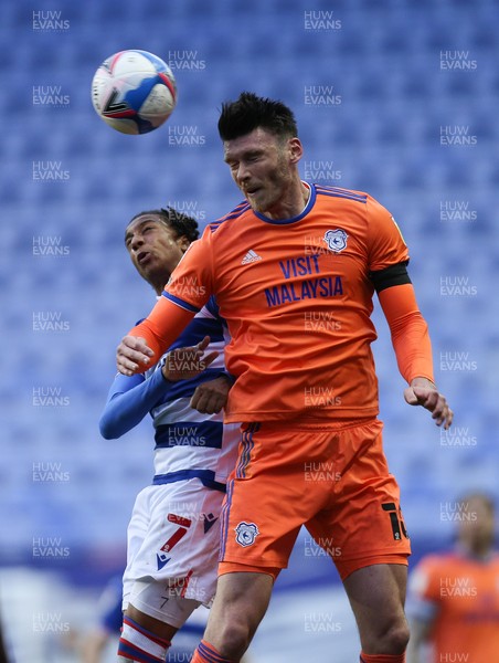 160421 Reading v Cardiff City, Sky Bet Championship - Kieffer Moore of Cardiff City and Michael Olise of Reading compete for the ball