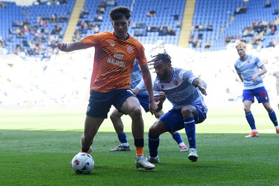 180426 - Reading v Cardiff City - Sky Bet League 1 - Rubin Colwill of Cardiff City is challenged by Andy Rinomhota of Reading