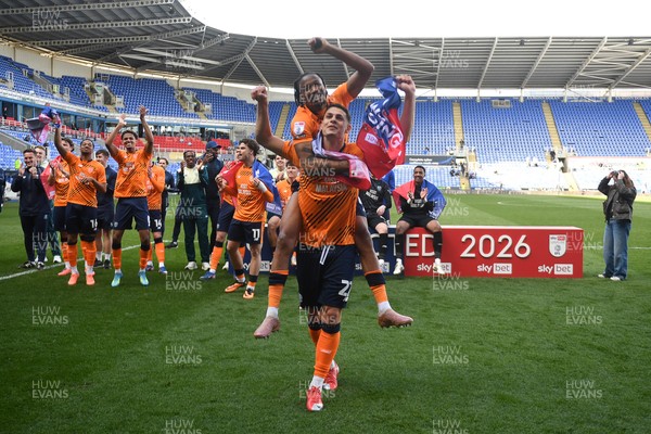 180426 - Reading v Cardiff City - Sky Bet League 1 - Yousef Salech of Cardiff City and Gabriel Osho of Cardiff City celebrate at full time after securing promotion back to the Championship