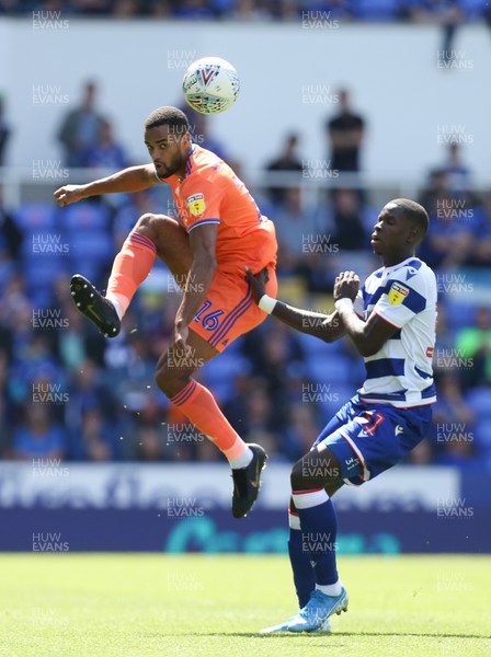 180819 - Reading v Cardiff City, Sky Bet Championship - Curtis Nelson of Cardiff City plays the ball past Lucas Joao of Reading