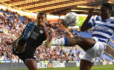 100821 - Reading v Swansea City - Carabao Cup - Joel Latibeaudiere of Swansea City is tackled by Nelson Abbey of Reading