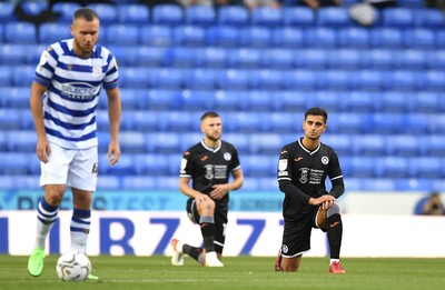 100821 - Reading v Swansea City - Carabao Cup - Yan Dhanda of Swansea City takes the knee