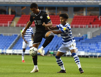 100821 - Reading v Swansea City - Carabao Cup - Morgan Whittaker of Swansea City is tackled by Claudio Gomes of Reading