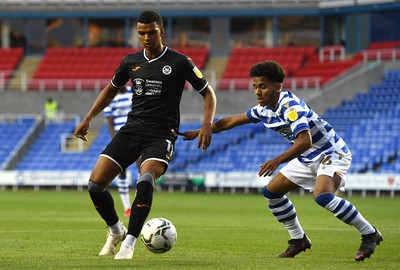 100821 - Reading v Swansea City - Carabao Cup - Morgan Whittaker of Swansea City is tackled by Claudio Gomes of Reading