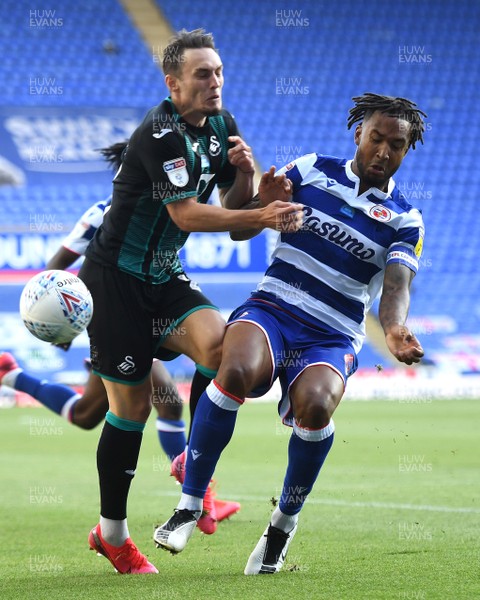 220720 - Reading v Swansea City - EFL SkyBet Championship - Connor Roberts of Swansea City and Liam Moore of Reading collide