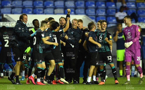 220720 - Reading v Swansea City - EFL SkyBet Championship - Swansea City players and staff celebrate at the end of the game
