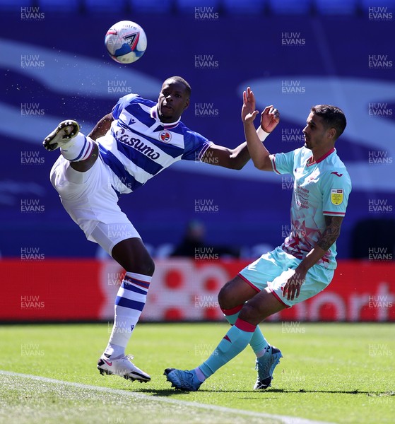 250421 - Reading v Swansea City - SkyBet Championship - Lucas Joao of Reading is challenged by Kyle Naughton of Swansea City