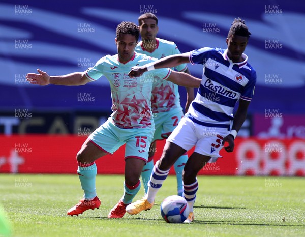 250421 - Reading v Swansea City - SkyBet Championship - Omar Richards of Reading is challenged by Wayne Routledge of Swansea City