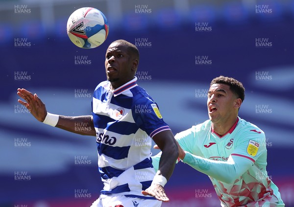250421 - Reading v Swansea City - SkyBet Championship - Lucas Joao of Reading is challenged by Ben Cabango of Swansea City