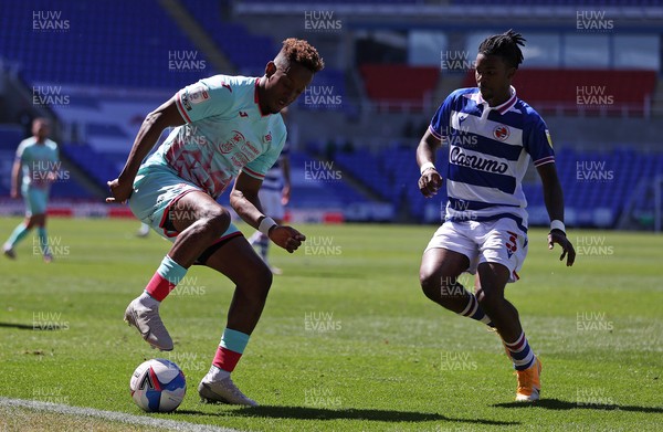250421 - Reading v Swansea City - SkyBet Championship - Jamal Lowe of Swansea City is challenged by Omar Richards of Reading