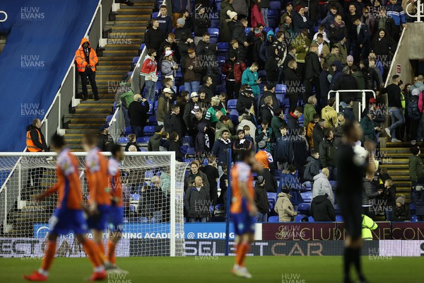 271222 - Reading v Swansea City - SkyBet Championship - Play stops whilst medical staff and police go the aid of a supporter amongst the Swansea fans