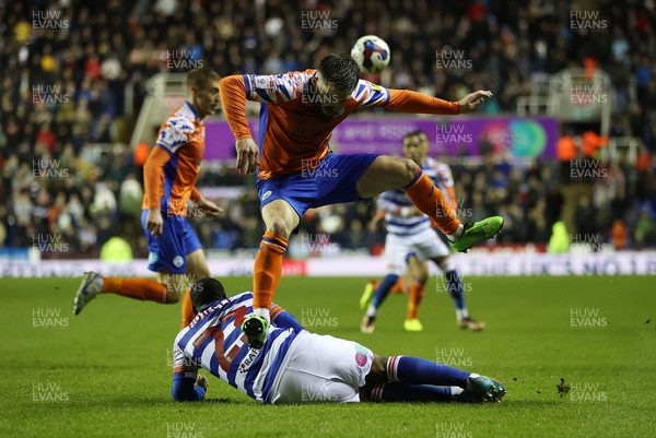 271222 - Reading v Swansea City - SkyBet Championship - Ryan Manning of Swansea City is tackled by Junior Hoilett of Reading