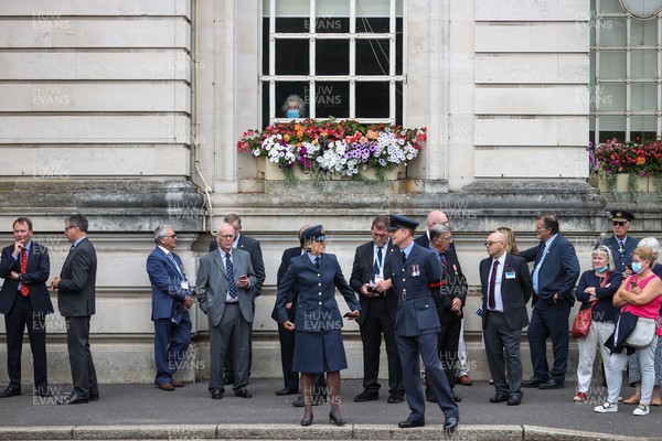 160921 - Picture shows a women wearing a face mask looking out the window as the Red Arrows flew over Cardiff City Hall to open a new exhibition of Wales's effort in the Battle of Britain