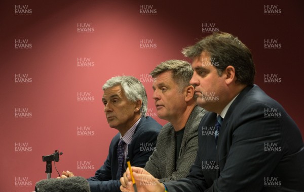 290814 - Regional Rugby Wales Press Conference, Liberty Stadium, Swansea - Gareth Davies, CEO of the Newport Gwent Dragons, left; Mark Davies, CEO of the Scarlets, centre, and Richard Holland, CEO of the Cardiff Blues, at a press conference to discuss the newly signed Rugby Services Agreement between the four Welsh Rugby Regions and the Welsh Rugby Union