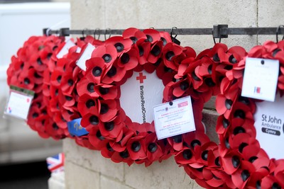 111125 - Remembrance Day - Tributes and wreaths left at the Newport Cenotaph after the a Remembrance memorial service on Sunday