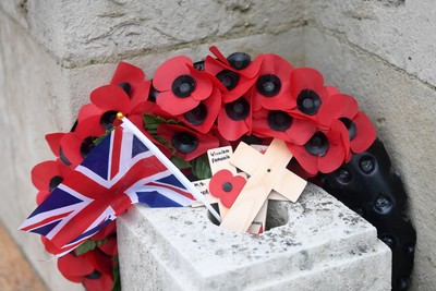 111125 - Remembrance Day - Tributes and wreaths left at the Newport Cenotaph after the a Remembrance memorial service on Sunday