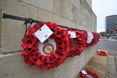 111125 - Remembrance Day - Tributes and wreaths left at the Newport Cenotaph after the a Remembrance memorial service on Sunday