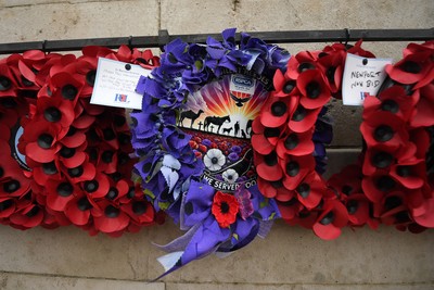111125 - Remembrance Day - Tributes and wreaths left at the Newport Cenotaph after the a Remembrance memorial service on Sunday