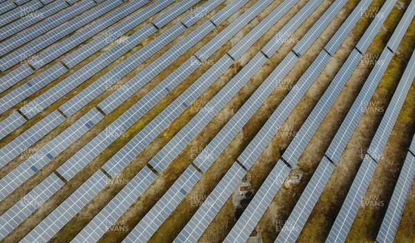 120422 - Picture shows an aerial view of rows of solar panels The green renewable energy being produced on former industrial land in Port Talbot, South Wales as the Welsh Government pushes to become net zero by 2050