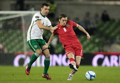 08.02.11 - Republic of Ireland v Wales - Carling Nations Cup -  Ireland's Darron Gibson attempts to tackle Andy King of Wales 