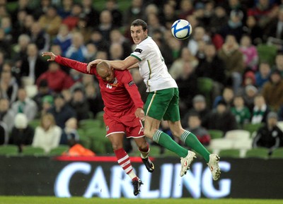 08.02.11 - Republic of Ireland v Wales - Carling Nations Cup -  Ireland's John O'Shea challenges Robert Earnshaw of Wales to the ball 