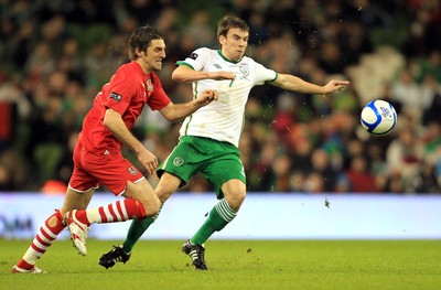 08.02.11 - Republic of Ireland v Wales - Carling Nations Cup -  Seamus Coleman of Ireland challenges Sam Ricketts of Wales for the ball 