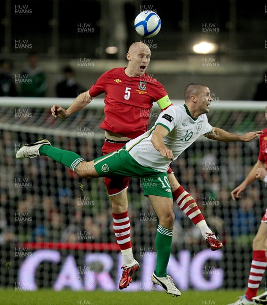 08.02.11 - Republic of Ireland v Wales - Carling Nations Cup -  Wales' James Collins heads the ball clear while being challenged by Ireland's Jonathan Walters 