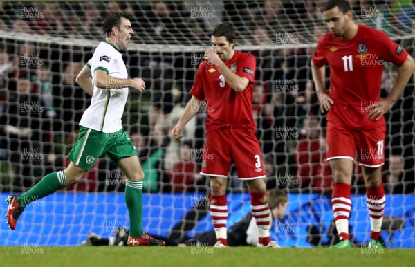 08.02.11 - Republic of Ireland v Wales - Carling Nations Cup -  Ireland's Darron Gibson celebrates the opening goal as Sam Ricketts and Hal Robson-Kanu of Wales look on dejected 