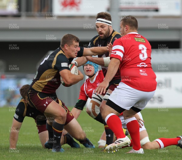 020917 - RGC1404 V Llanelli RFC - Principality Premiership -  Tom Hughes of RGC hands off Simon Gardiner of Llanelli RFC